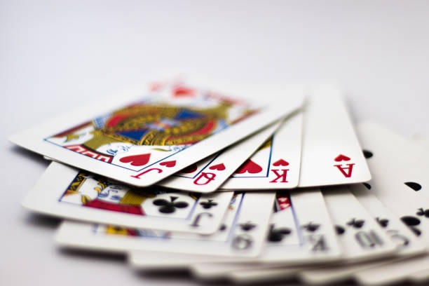 Live dealer studio with multi-camera setup showing baccarat and blackjack tables